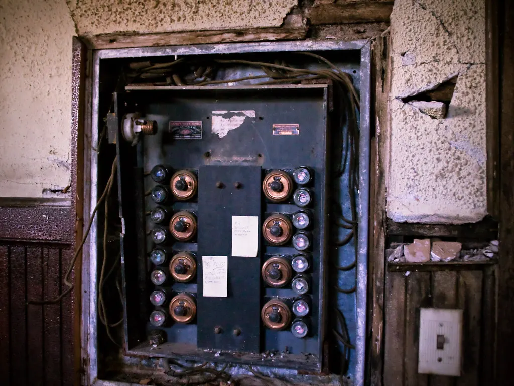 Old electrical panel with fuses in a wall