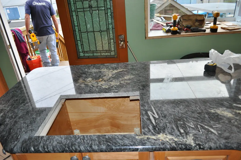 Kitchen remodel in progress with new granite countertops
